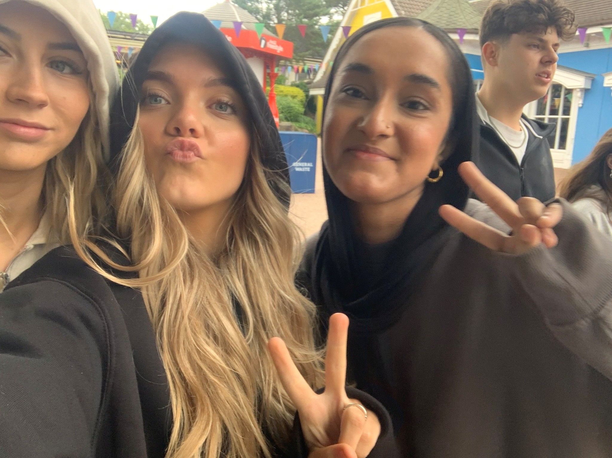 3 young girls posing for a selfie.