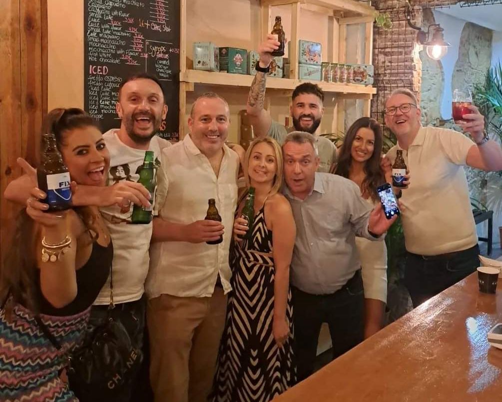 Team photo cheering in a bar