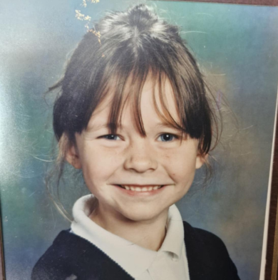 Photo of a smiling school girl in a frame