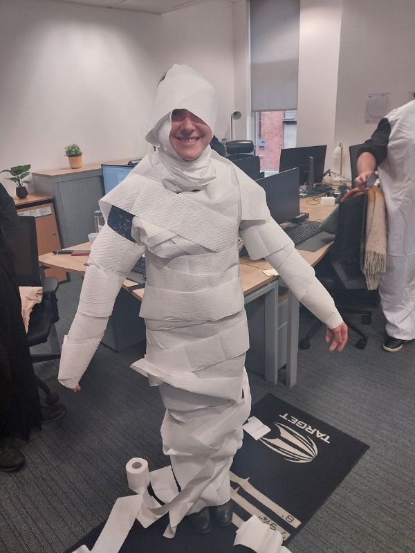 Recruiter dressed up for halloween wrapped in toilet paper