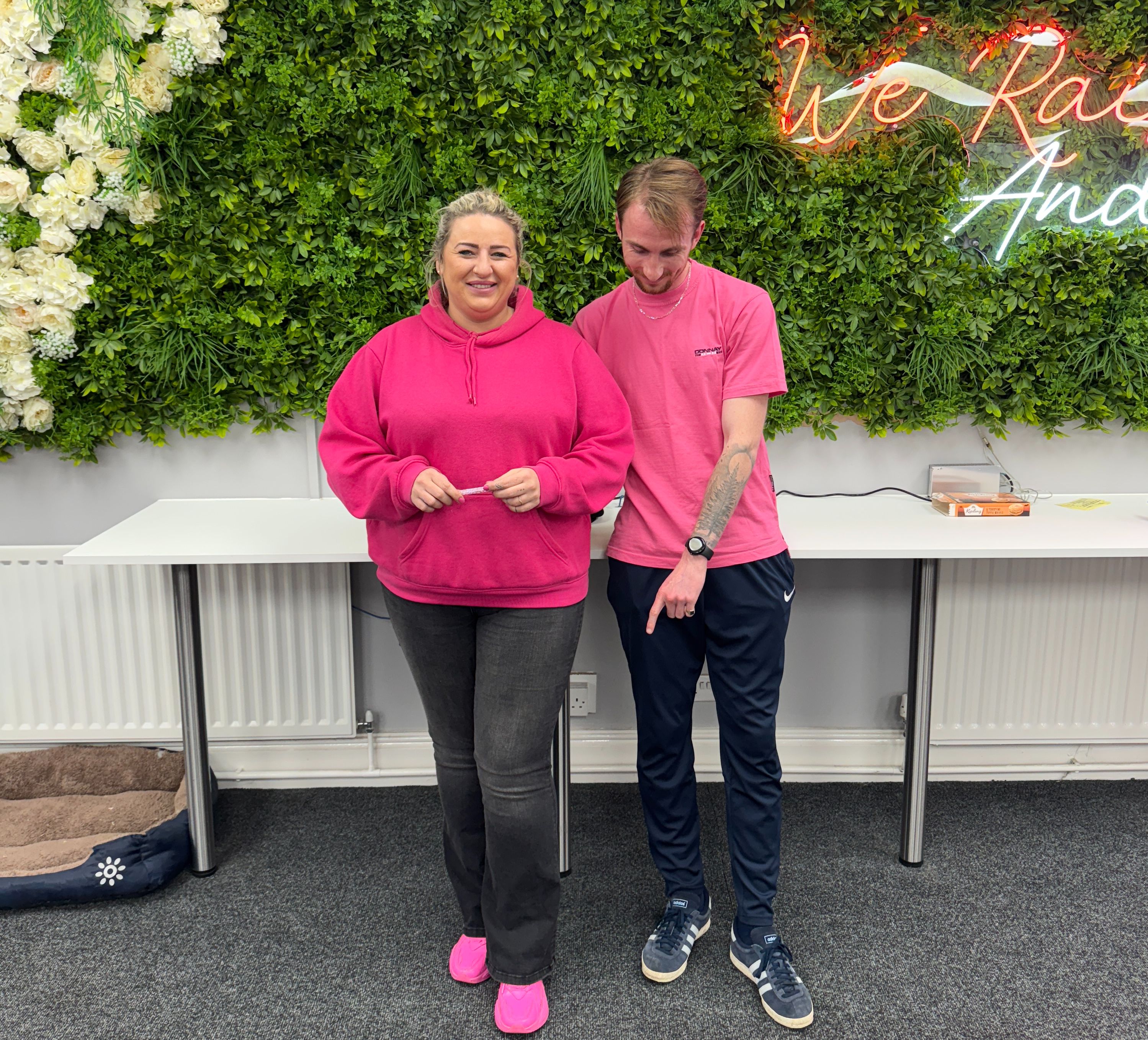 Man and woman dressed in pink clothes