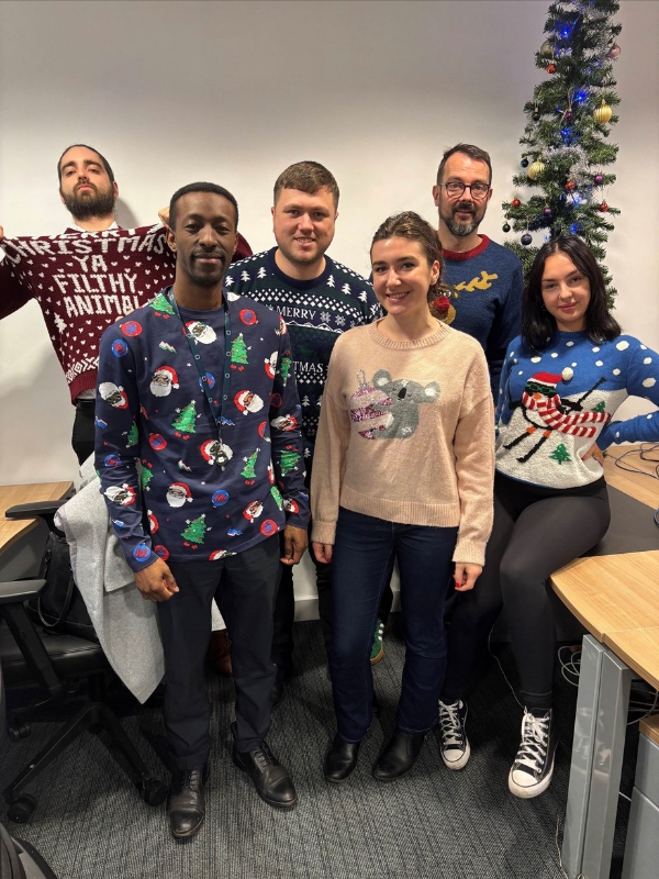 Manchester recruiters group photo in christmas jumpers.