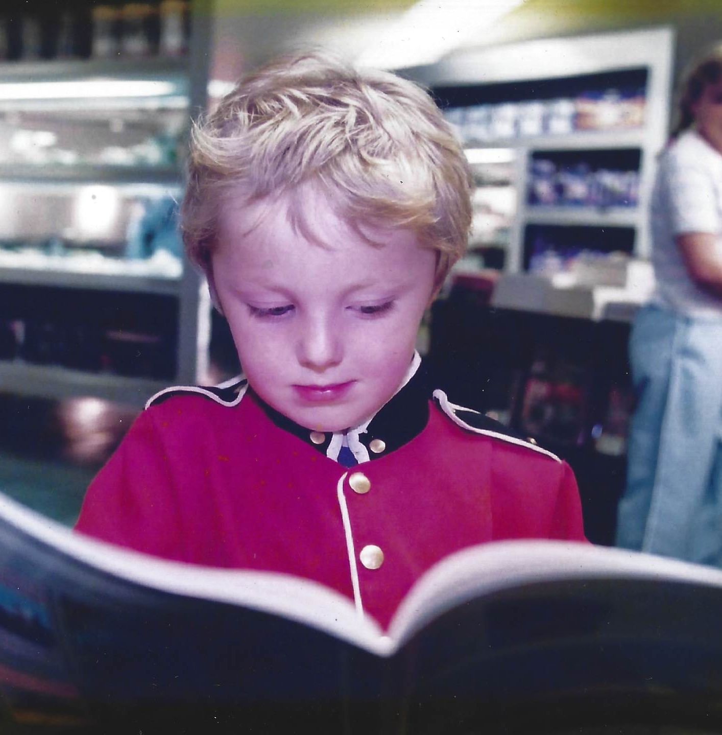 A young boy reading a book