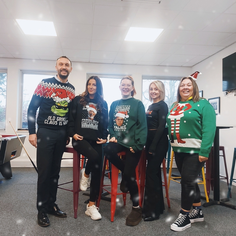 Group photo in christmas jumpers