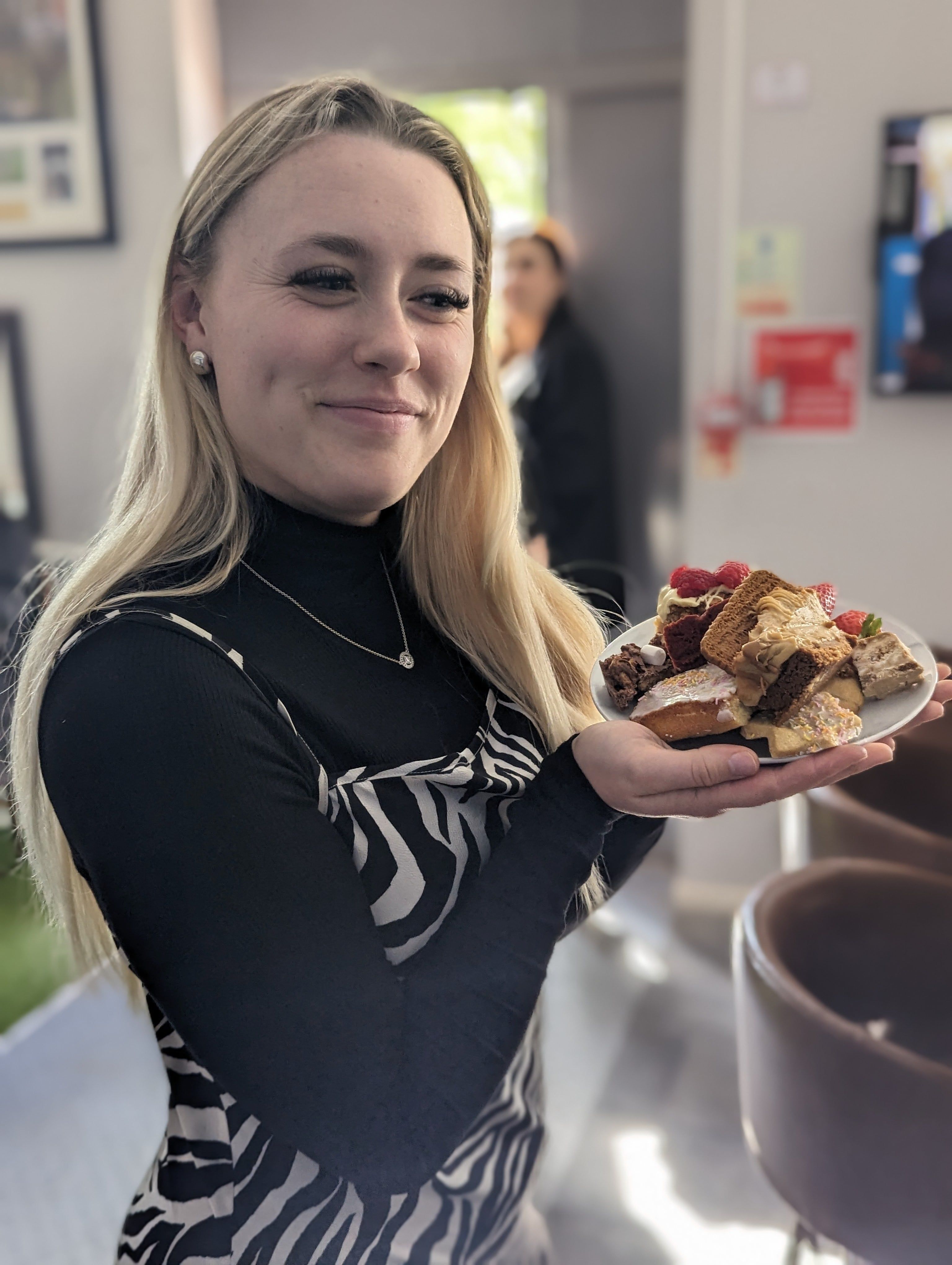 Blonde Lady with a plate of cakes