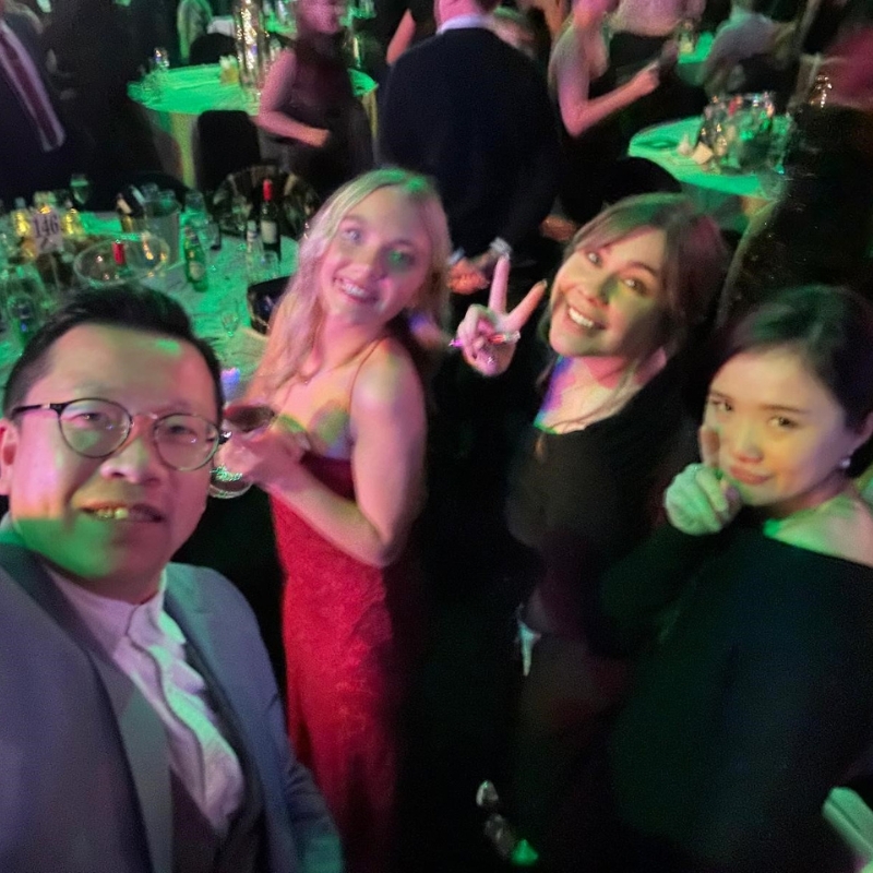 A man and 3 women recruiters at a christmas party.